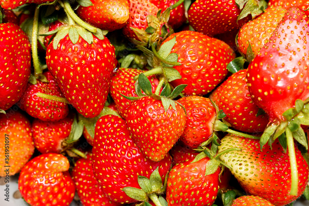 Strawberries on a market stall. Strawberries in bowl Strawberries on a market stall. Strawberries in bowl