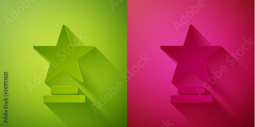 Paper cut Movie trophy icon isolated on green and pink background. Academy award icon. Films and cinema symbol. Paper art style. Vector Illustration.