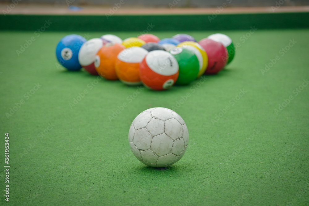 Balls stacked in a triangle ready for soccer billiards Balls stacked in a triangle ready for soccer billiards