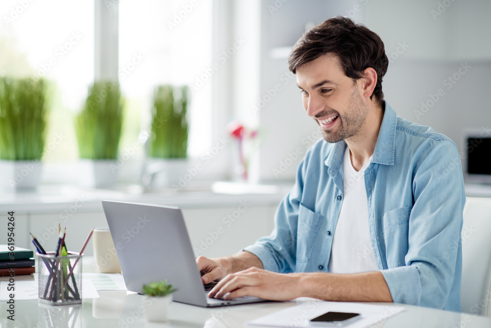Photo of handsome guy student businessman browsing laptop notebook sitting table desktop video call teacher working house online lesson conference social distance quarantine indoors Photo of handsome guy student businessman browsing laptop notebook sitting table desktop video call teacher working house online lesson conference social distance quarantine indoors