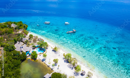 Panorama with a aerial top view as perspective of the Sumilon island beach landing near Oslob, Cebu, Philippines.