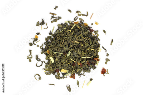 green tea loose leaf with fruit slices isolated on white