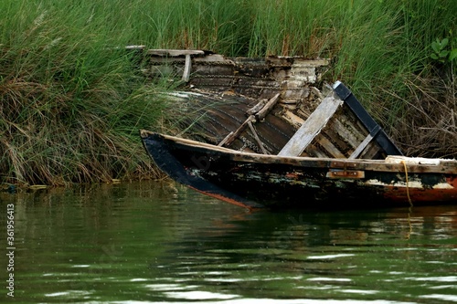 Floating wooden boat on the river