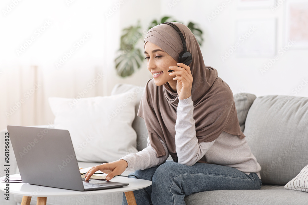 Online Education. Young Arabic Woman In Hijab Study With Laptop At Home Online Education. Young Arabic Woman In Hijab Study With Laptop At Home