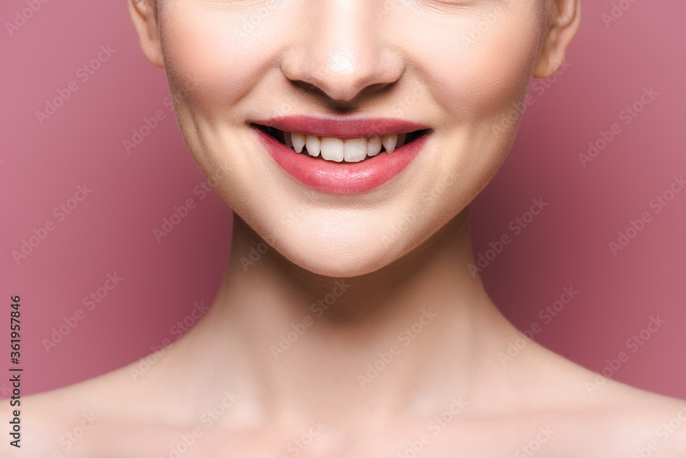 cropped view of happy young woman with lipstick on lips on pink cropped view of happy young woman with lipstick on lips on pink