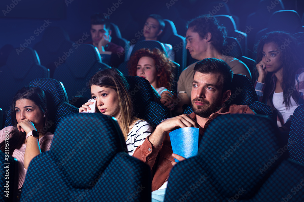 Group of people watching sad movie in cinema. Group of people watching sad movie in cinema.