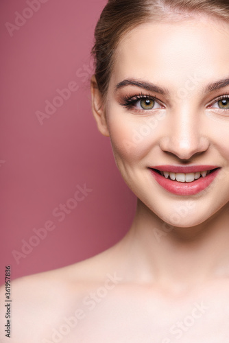naked and happy young woman smiling on pink