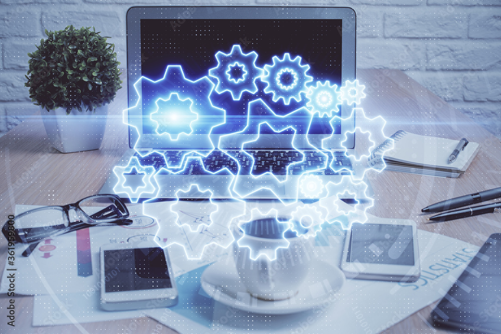 Double exposure of business theme icons and work space with computer background. Concept of success. Double exposure of business theme icons and work space with computer background. Concept of success.