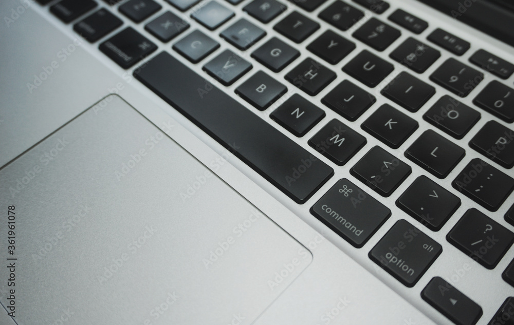 Close up of a laptop's keyboard with selective focus.