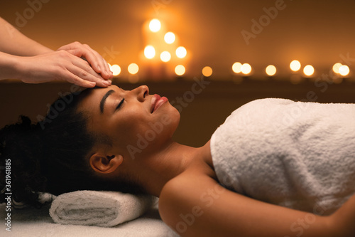 Indian massage in romantic atmosphere for black woman