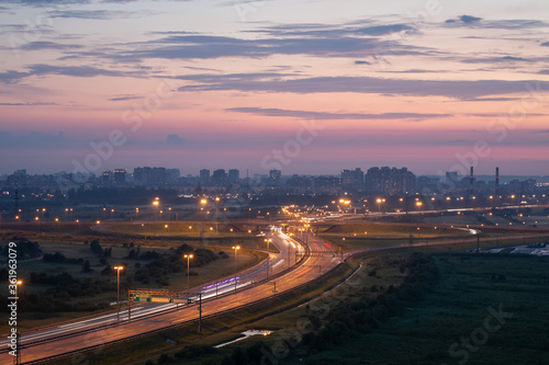 city ​​lights and road at dusk © Svetlana