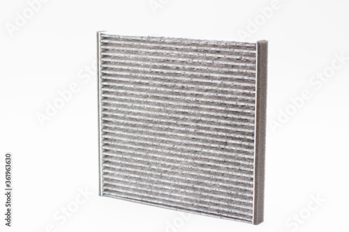 Carbon car air filter on white background