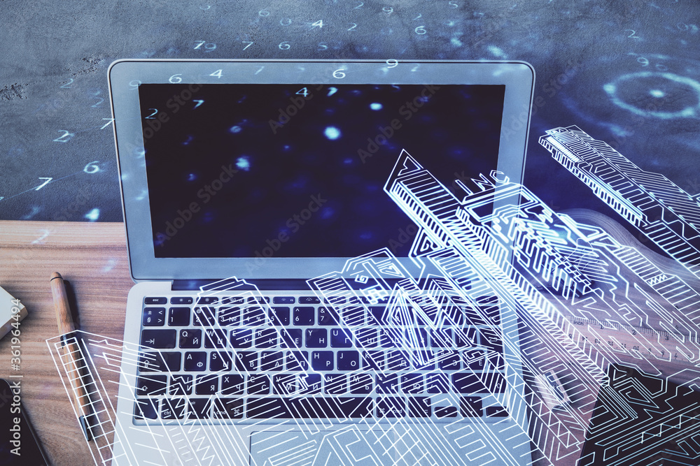 Desktop computer background in office and big town buildings hologram ...