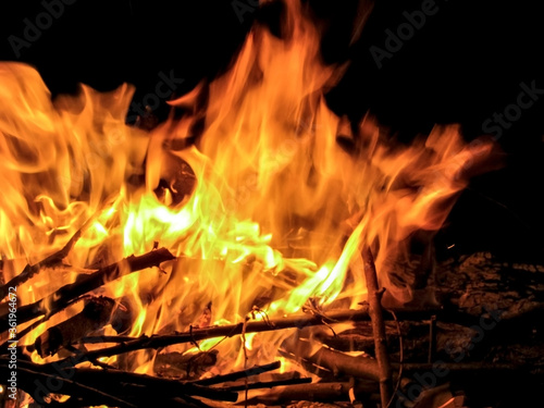 bonfire on Ivan Kupala. bonfire with branches at night in the forest. tongues of fire. flames of fire. night fire 