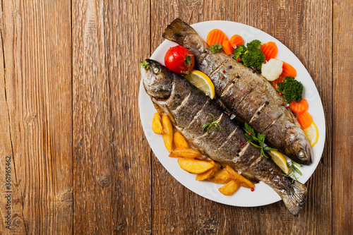 Grilled whole trout. Served with baked potatoes.