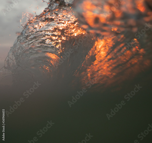 Artistic photo of a wave at sunset