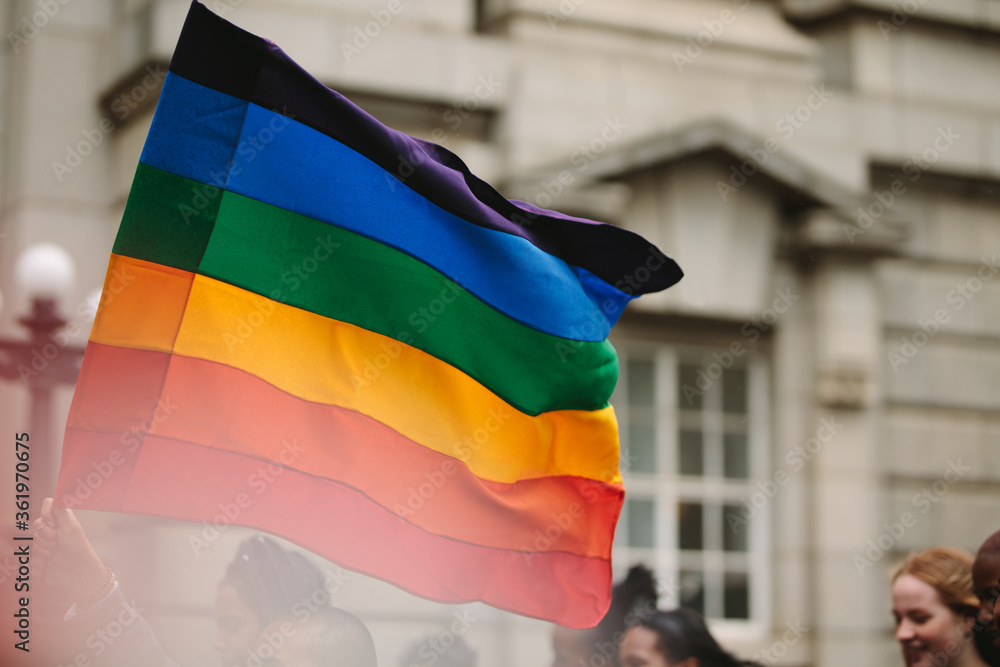 Pride parade with gay rainbow flag in the city Stock Photo | Adobe Stock