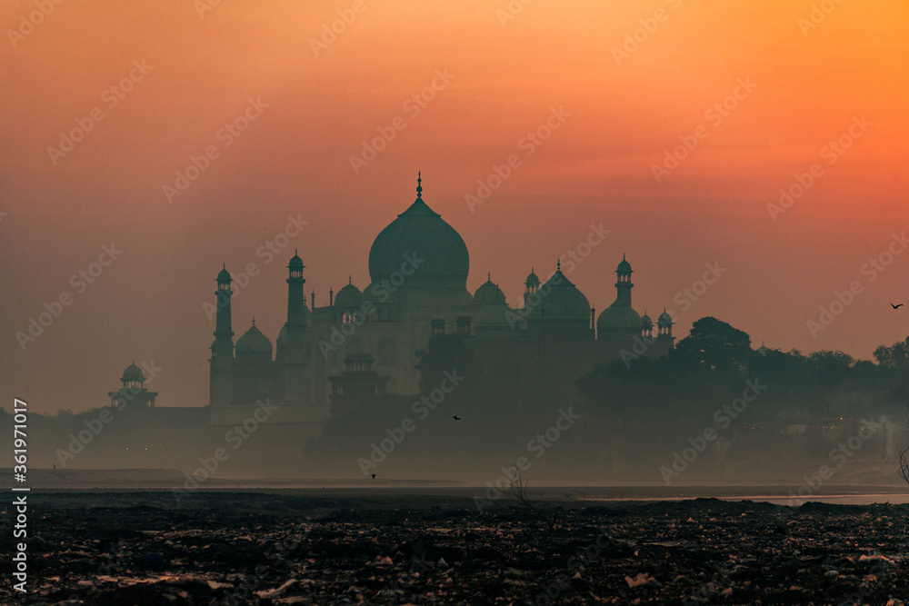 A long distance view of the Taj Mahal from the banks of Yamuna River in Agra