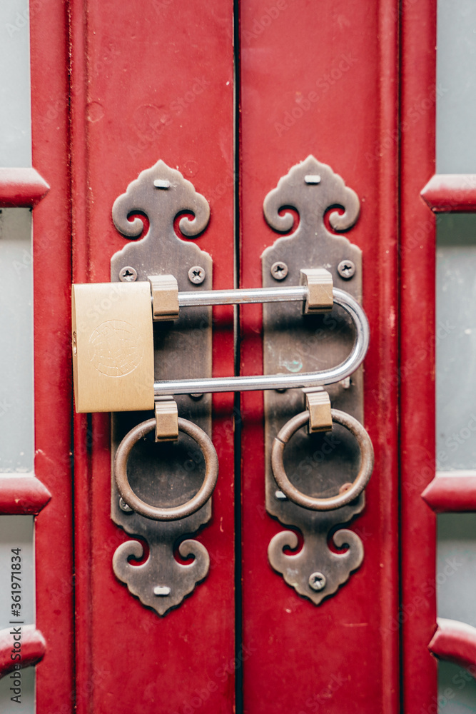 A vintage lock on a antique wooden door.