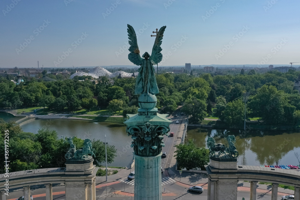 Obraz premium Heroes' Square or the Millennium Monument is the most important attraction of the city. Archangel Gabriel at the top of the Corinthian column. Tourist attraction Budapest, Hungary.