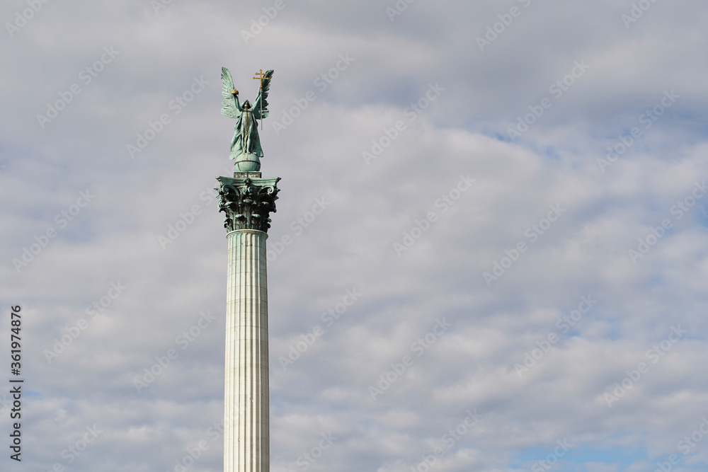Heroes' Square or the Millennium Monument is the most important attraction of the city. Archangel Gabriel at the top of the Corinthian column. Tourist attraction Budapest, Hungary.