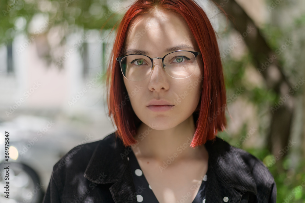 Portrait of beautiful redhead woman wearing glasses. Portrait of beautiful redhead woman wearing glasses.