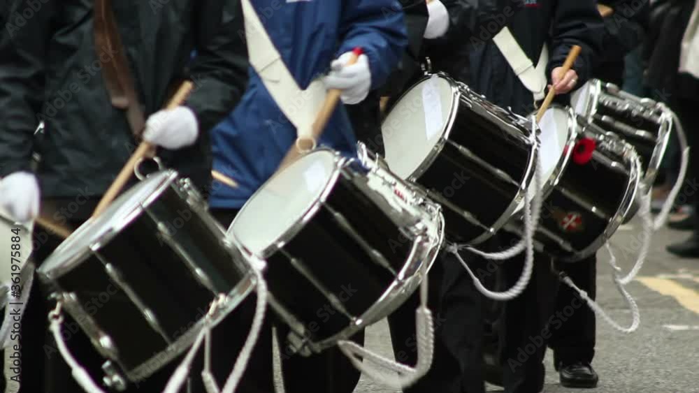Marching Band with Drums walking during a parade. March on the streets with musical instruments. Stock Video Clip Footage Marching Band with Drums walking during a parade. March on the streets with musical instruments. Stock Video Clip Footage