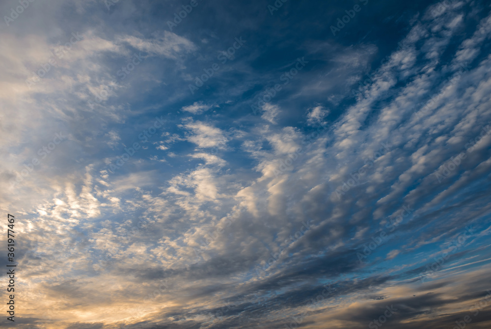Clouds at sunset. Clouds. Cumulus sunset clouds with sun setting down. Clouds at sunset. Clouds. Cumulus sunset clouds with sun setting down.