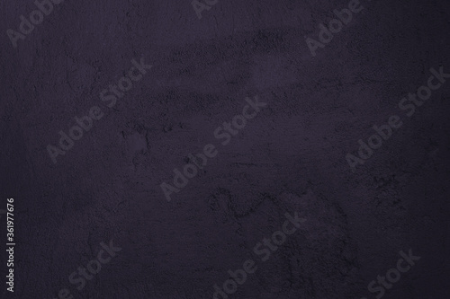 Dark purple background. Stucco texture.