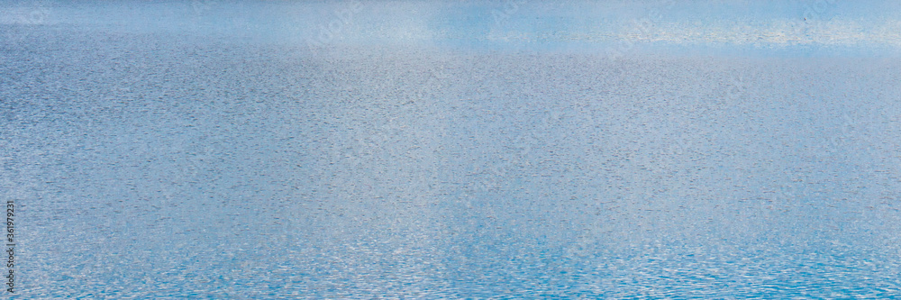 Abstract beautiful blue water surface on lake.