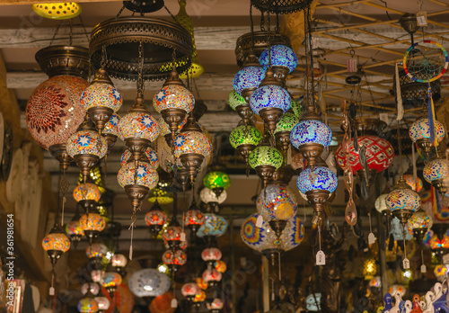 Greece. Heraklion. 18.08.2017. Bright, colorful lamps in greek national style hanging on the ceiling in a souvenir shop on the main street of Heraklion, Crete. Красочные светильники.