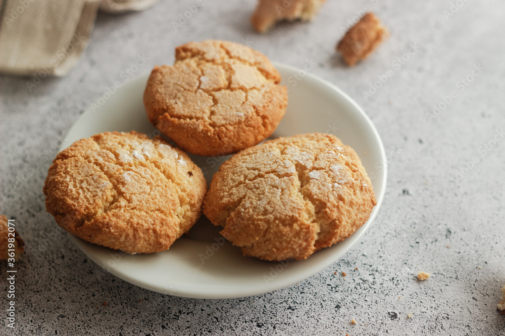 Tasty almond cookies with milk. Cookies on a plate Tasty almond cookies with milk. Cookies on a plate