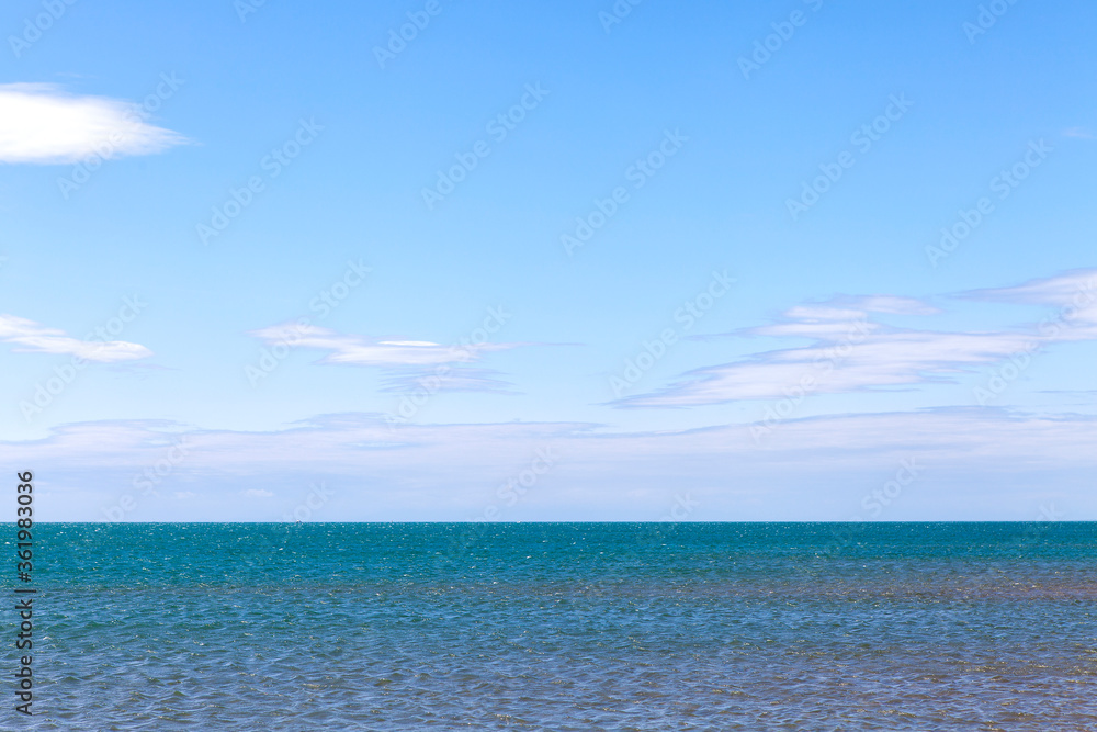 Ocean view against blue sky
