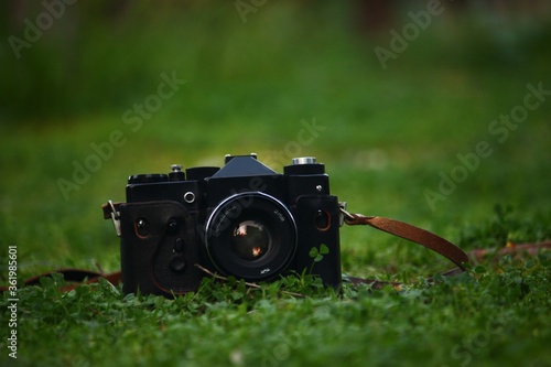 A vintage camera with a kid playing with it 