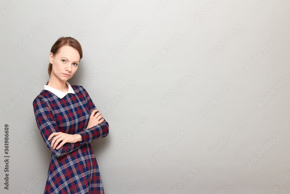 Portrait of serious concentrated girl holding arms crossed on chest Portrait of serious concentrated girl holding arms crossed on chest