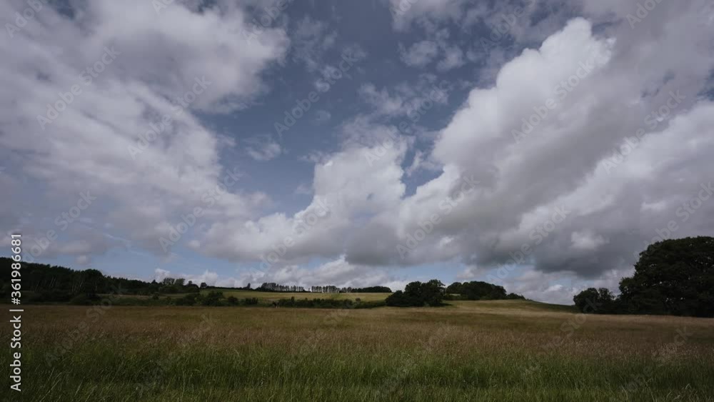 British countryside cloudscape over a meadow British countryside cloudscape over a meadow