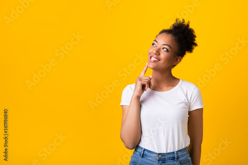 Portrait of black girl looking up at studio