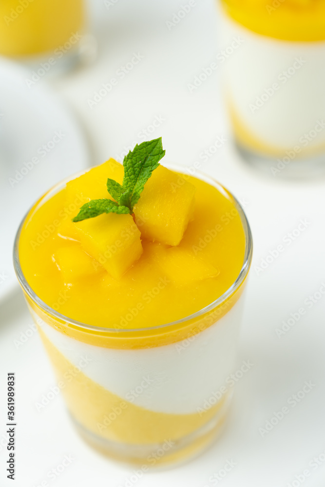 Italian dessert mango panna cotta decorated with fresh mango and mint Italian dessert mango panna cotta decorated with fresh mango and mint