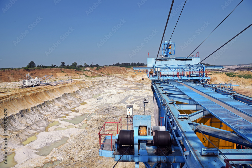 Amazing view from the top of a huge excavator on a surface mine. An unreal open pit landscape. Interesting geological structures. Amazing view from the top of a huge excavator on a surface mine. An unreal open pit landscape. Interesting geological structures.