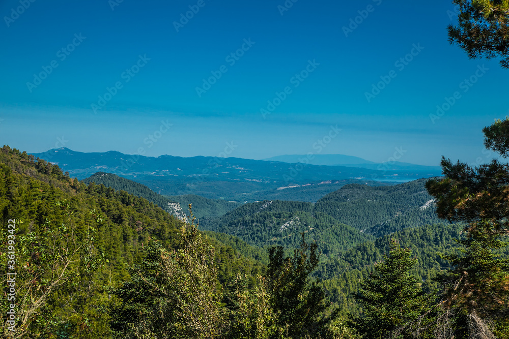 Panoramic view from above on the forests of Evia island with the sea . Evia . Greece. Panoramic view from above on the forests of Evia island with the sea . Evia . Greece.