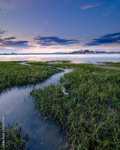 Spring sunset over Bosham harbour and village from Bosham Hoe  West Sussex  UK