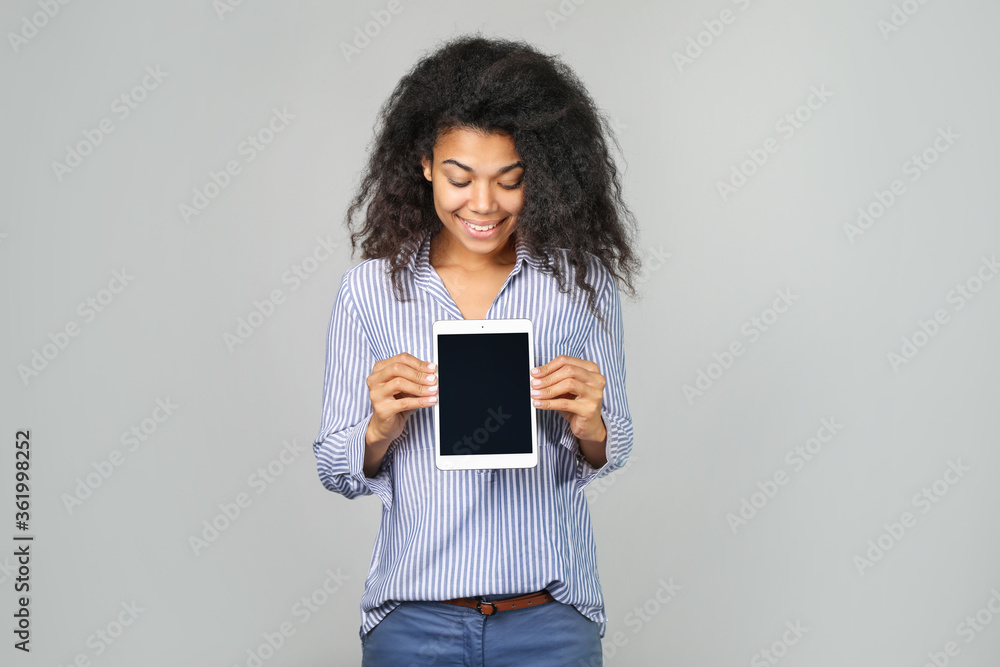 Portrait of a beautiful african woman with tablet in hand Portrait of a beautiful african woman with tablet in hand
