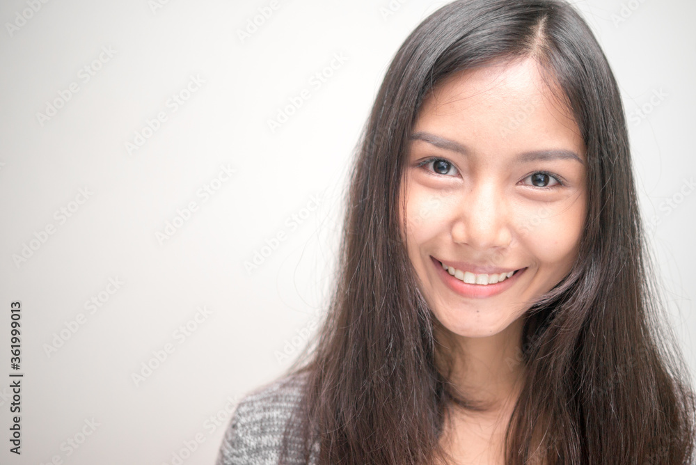 Face of happy young beautiful Asian teenage girl smiling