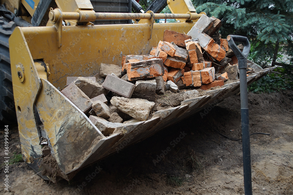 old bricks removed by an excavator