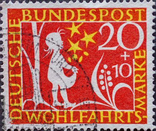 GERMANY - CIRCA 1959  a postage stamp printed in Germany showing Motifs from the fairytale Stern thaler by the Brothers Grimm as a silhouette