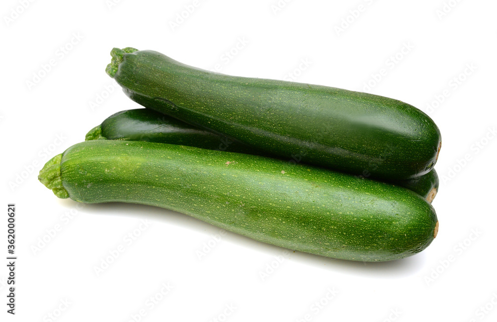Three fresh green zucchini isolated on white background Three fresh green zucchini isolated on white background
