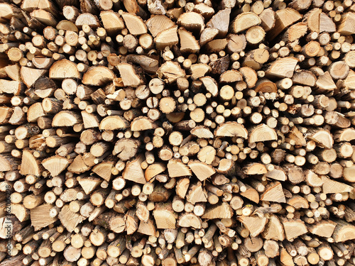 Background of firewood on a sunny day.