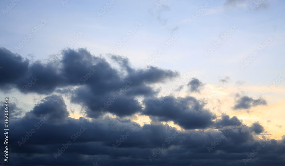 Dark clouds before rain on blue sky background