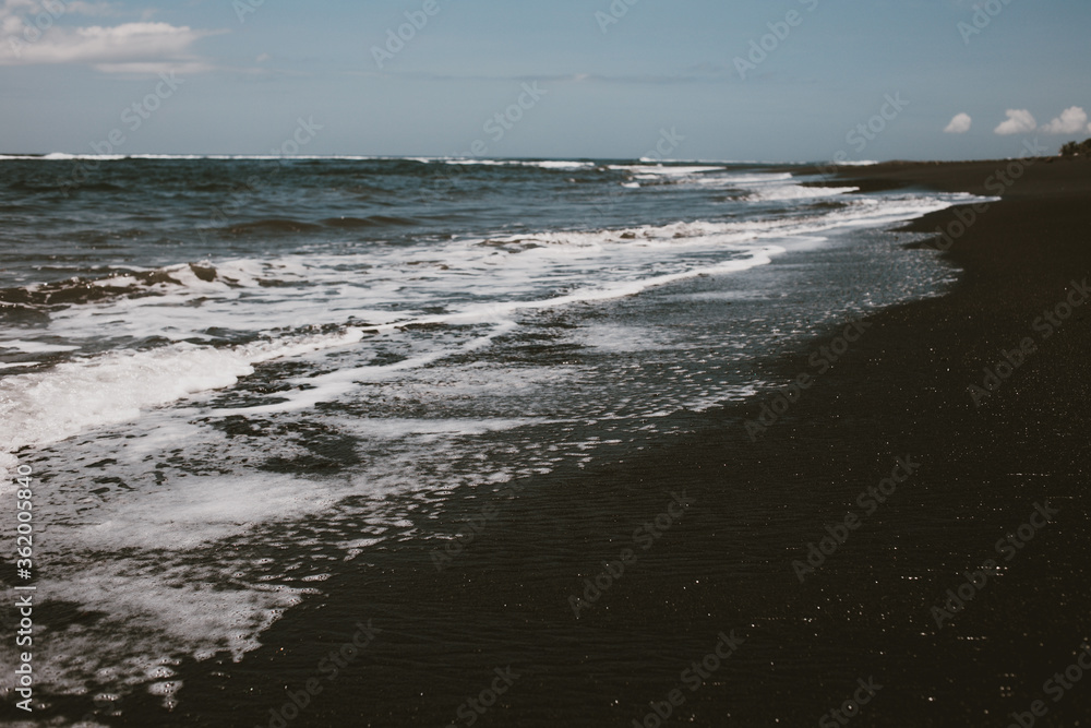 beach of Indian ocean with black sand beach of Indian ocean with black sand