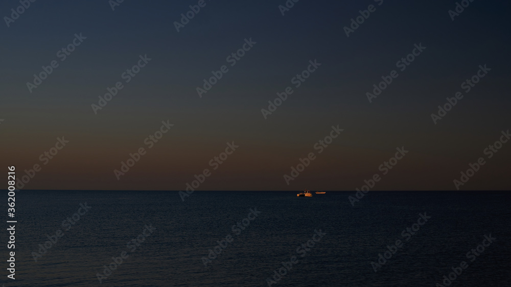 ship on the horizon in the Black Sea at sunset